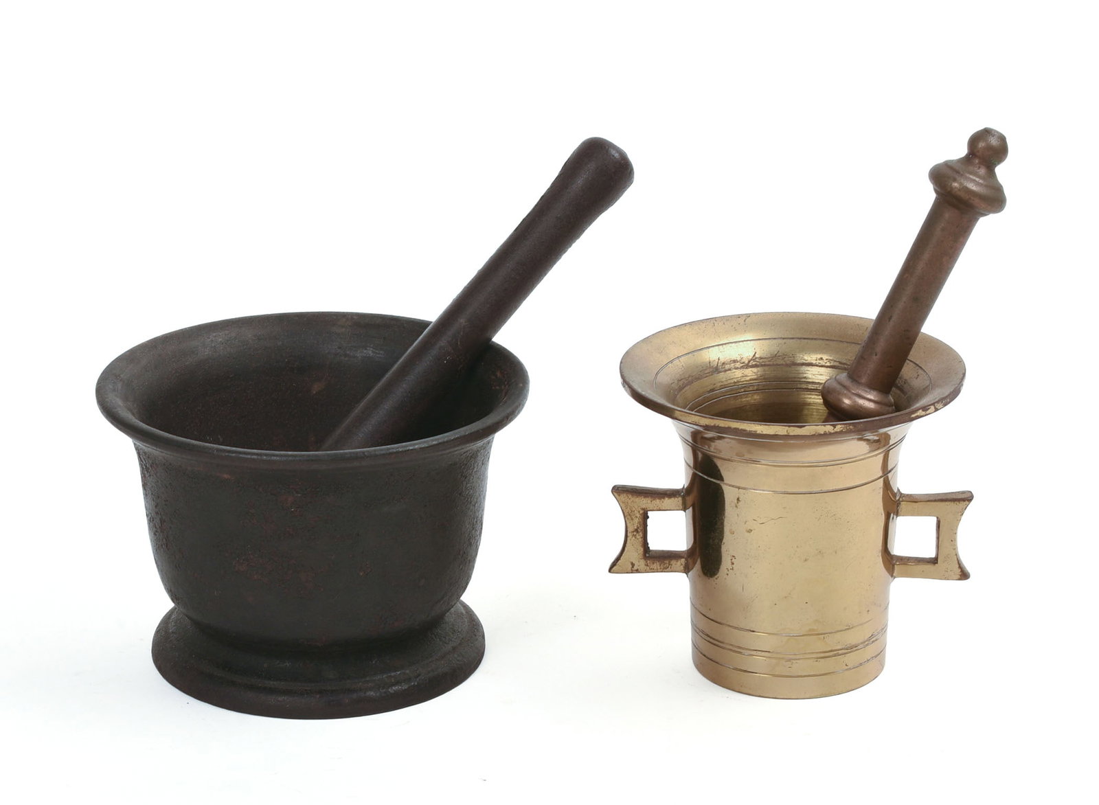 TWO MORTAR AND PESTLES.: One brass, height 4.25 inches, the other cast iron.