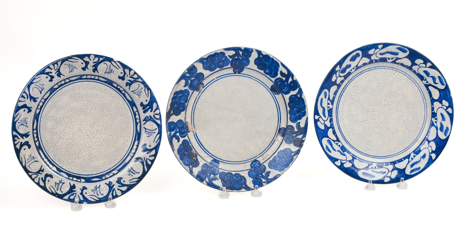 THREE DEDHAM POTTERY PLATES.: Diameter 9.75 inches. Some surface loss and rim chips.