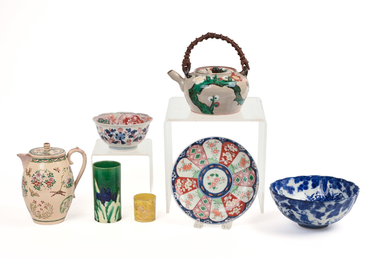 Lot of Japanese Ceramics: 19th/early 20th century. 7 pieces, including pitcher, height 6 inches, teapot, two bowls, imari plate, a vase and a small cup.