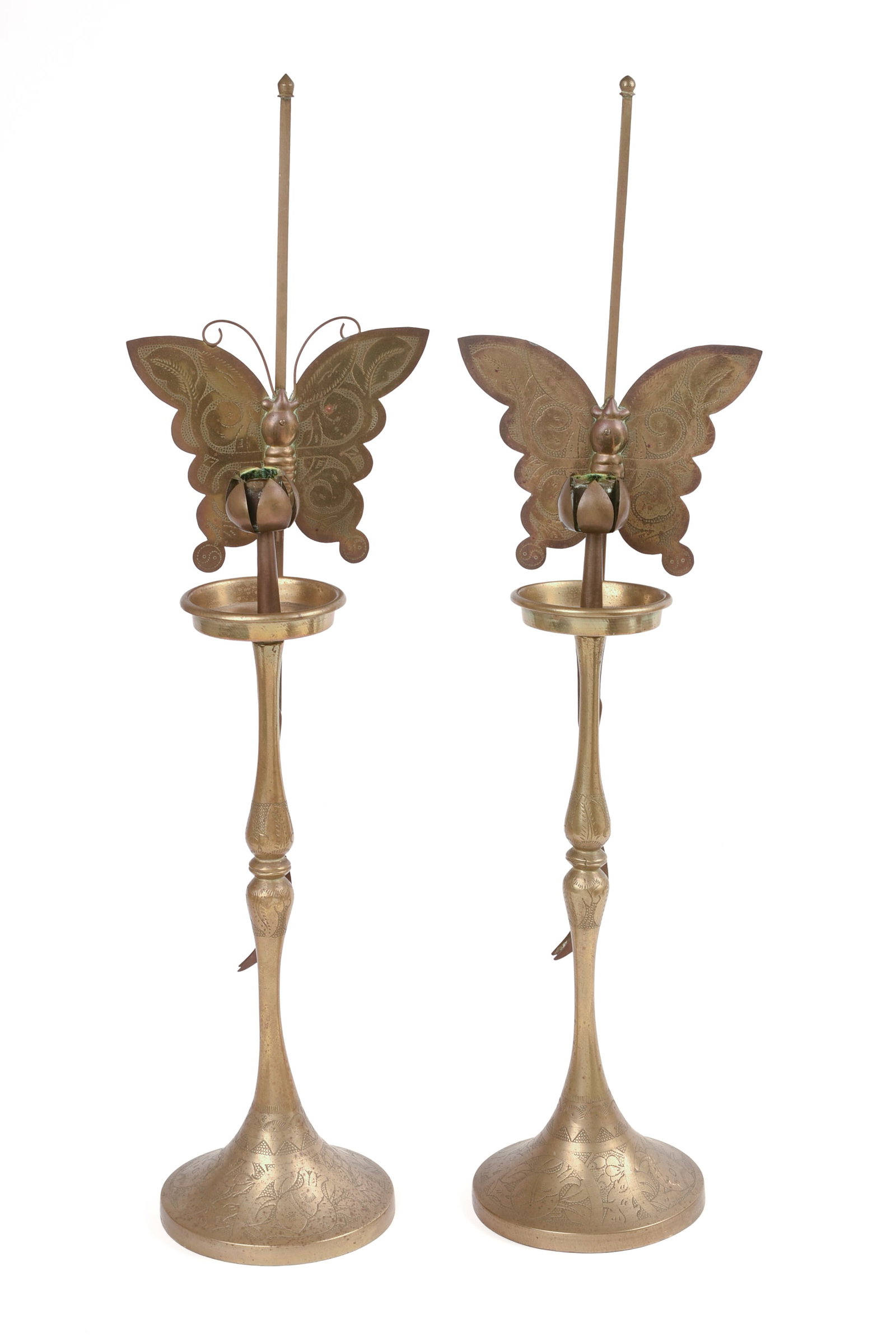 Pair of Chinese Brass Butterfly Candle Sticks: Each with butterfly candle back and attached tongs, late 19th/early 20th century, height 22 inches.