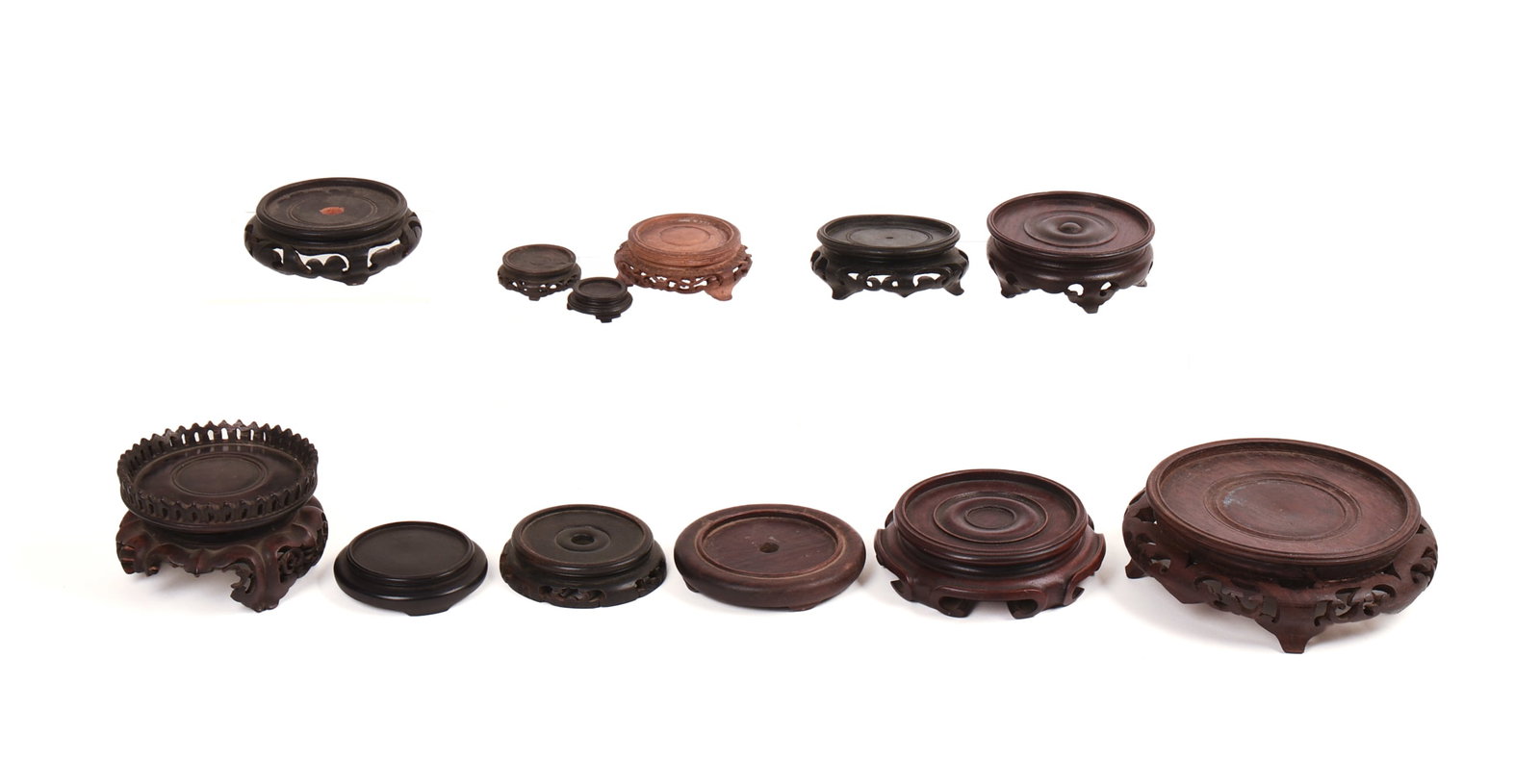 Twelve Carved Chinese Wooden Display Stands: Diameter of largest 5 inches, some as is.