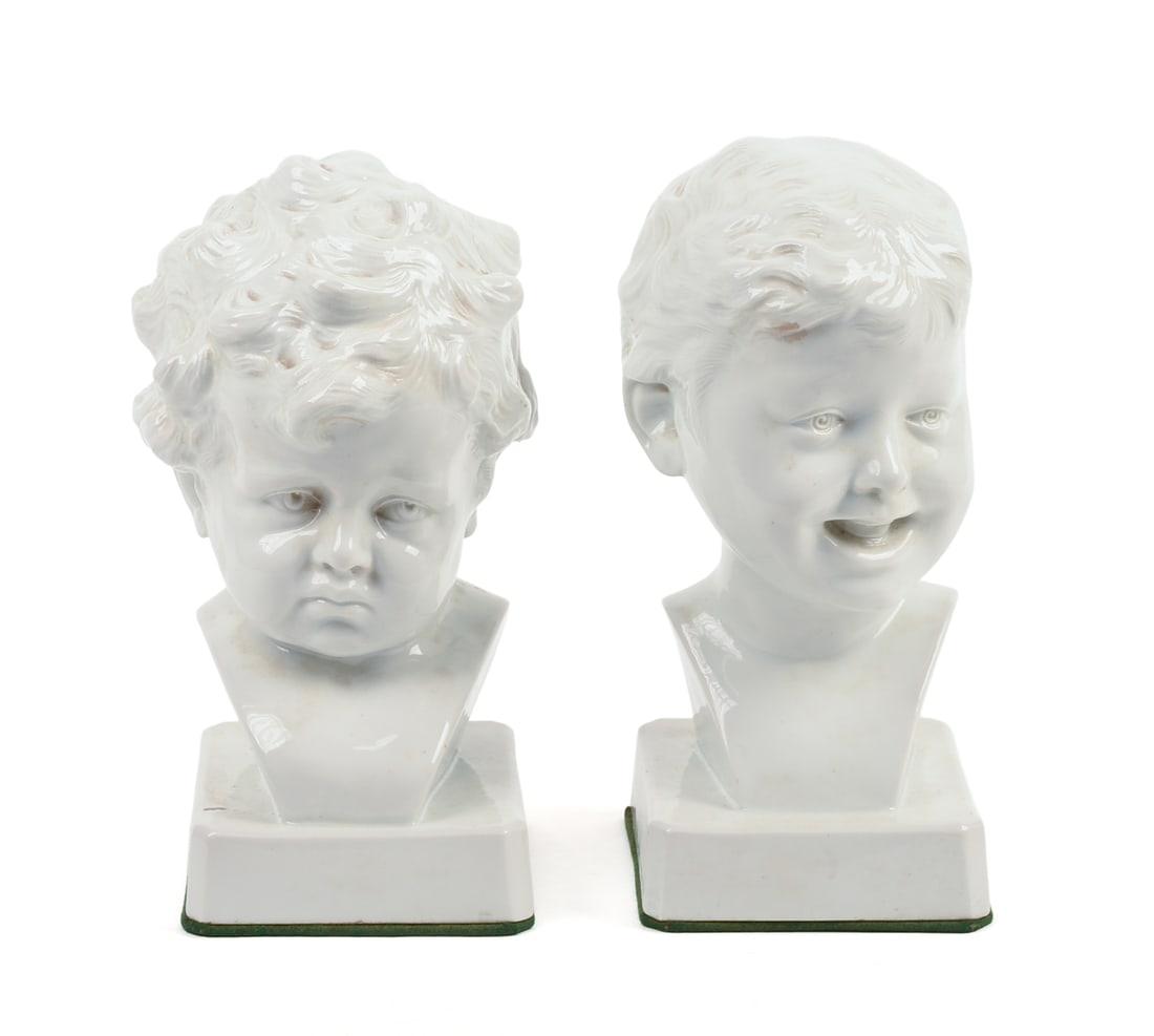 Pair of Signed Continental White Porcelain Busts of Boys: Height 9.5 inches. Finely modeled, underglaze blue crossed branches mark on each, one marked Donatello, the other signed Kaesbach