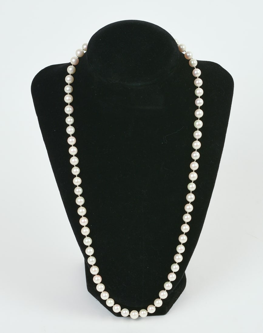Strand of Cultured Pearls: With 14KT Gold Clasp, length 22 inches.