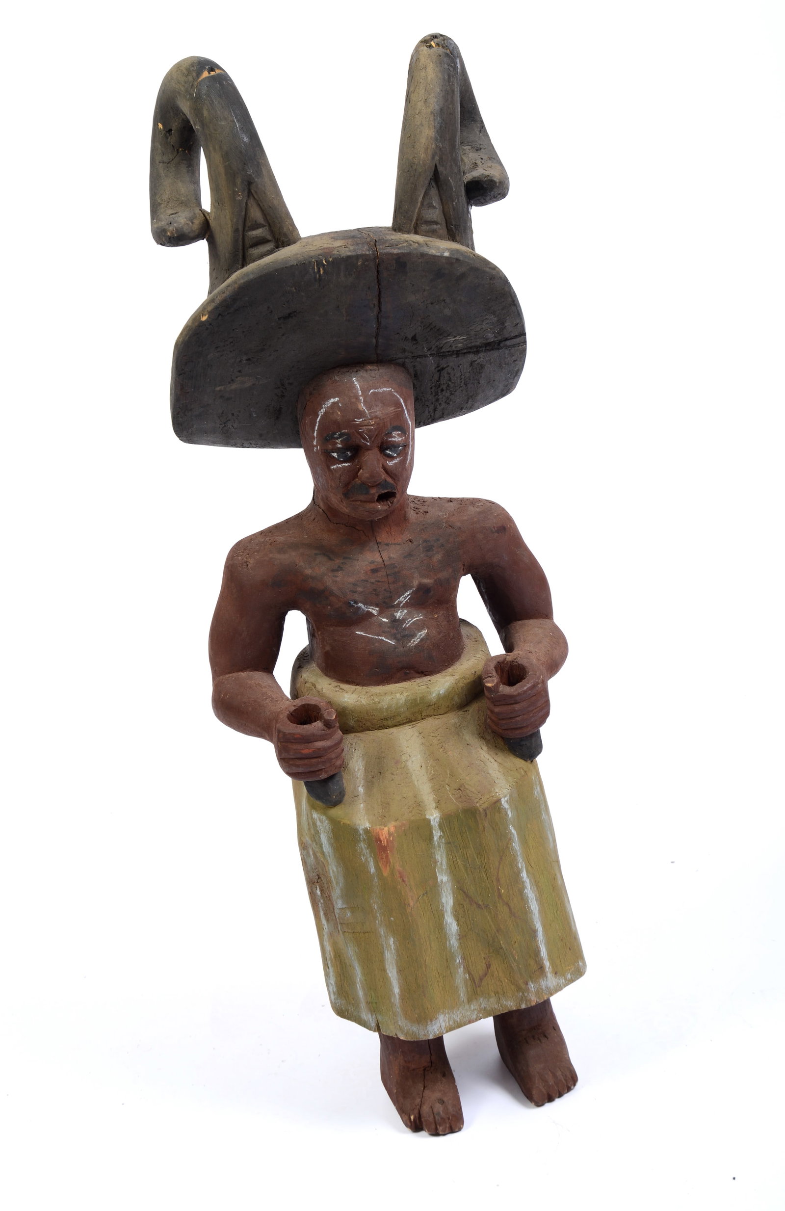 African Carved Figure of a Seated Man.: Height 30 inches. Painted wood, some losses. Signed Moks 0093-74