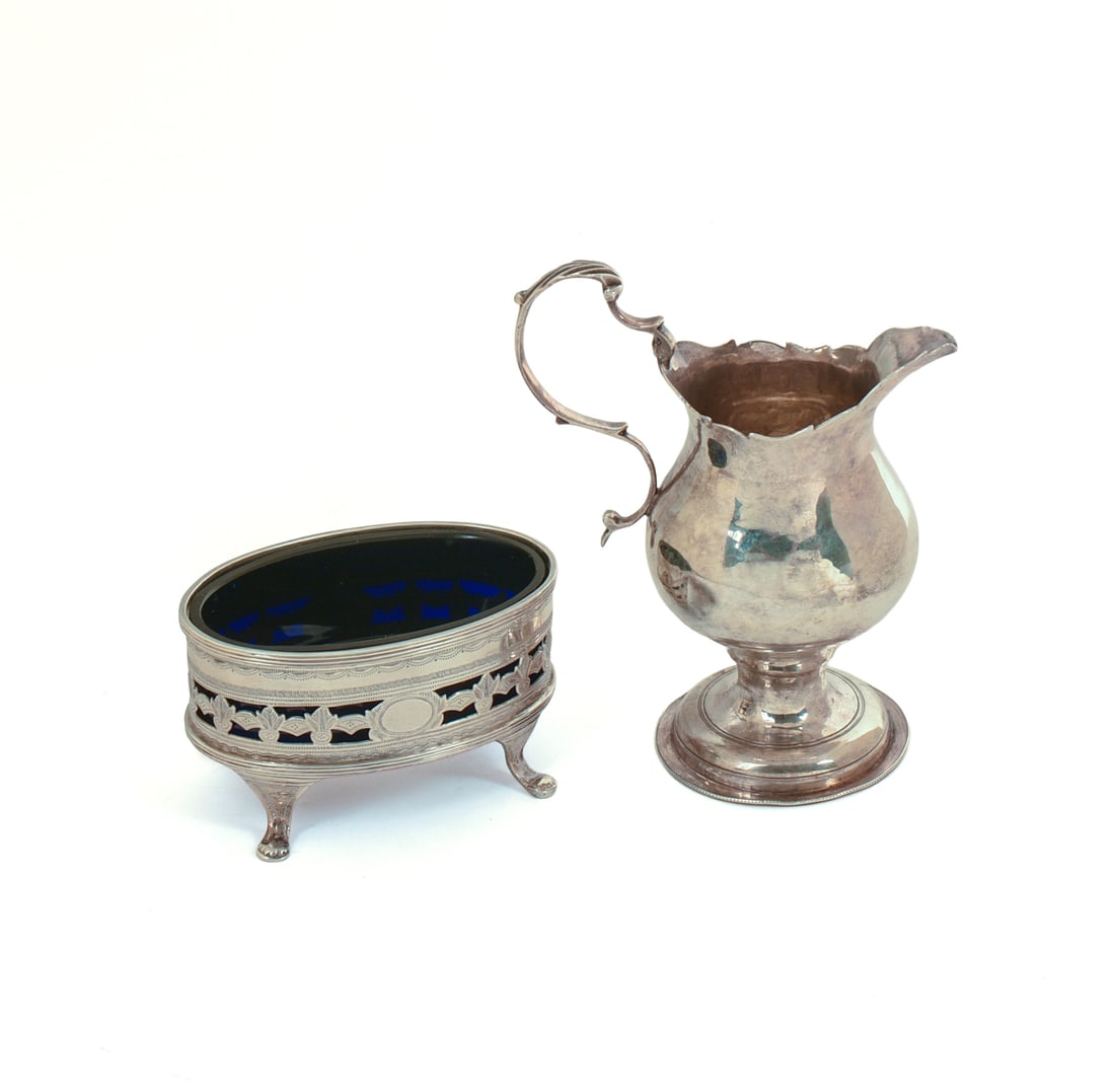 English Sterling Creamer and a Salt.: The creamer hallmarked CH, height 4 inches, 80 grams. The salt with cobalt blue liner.