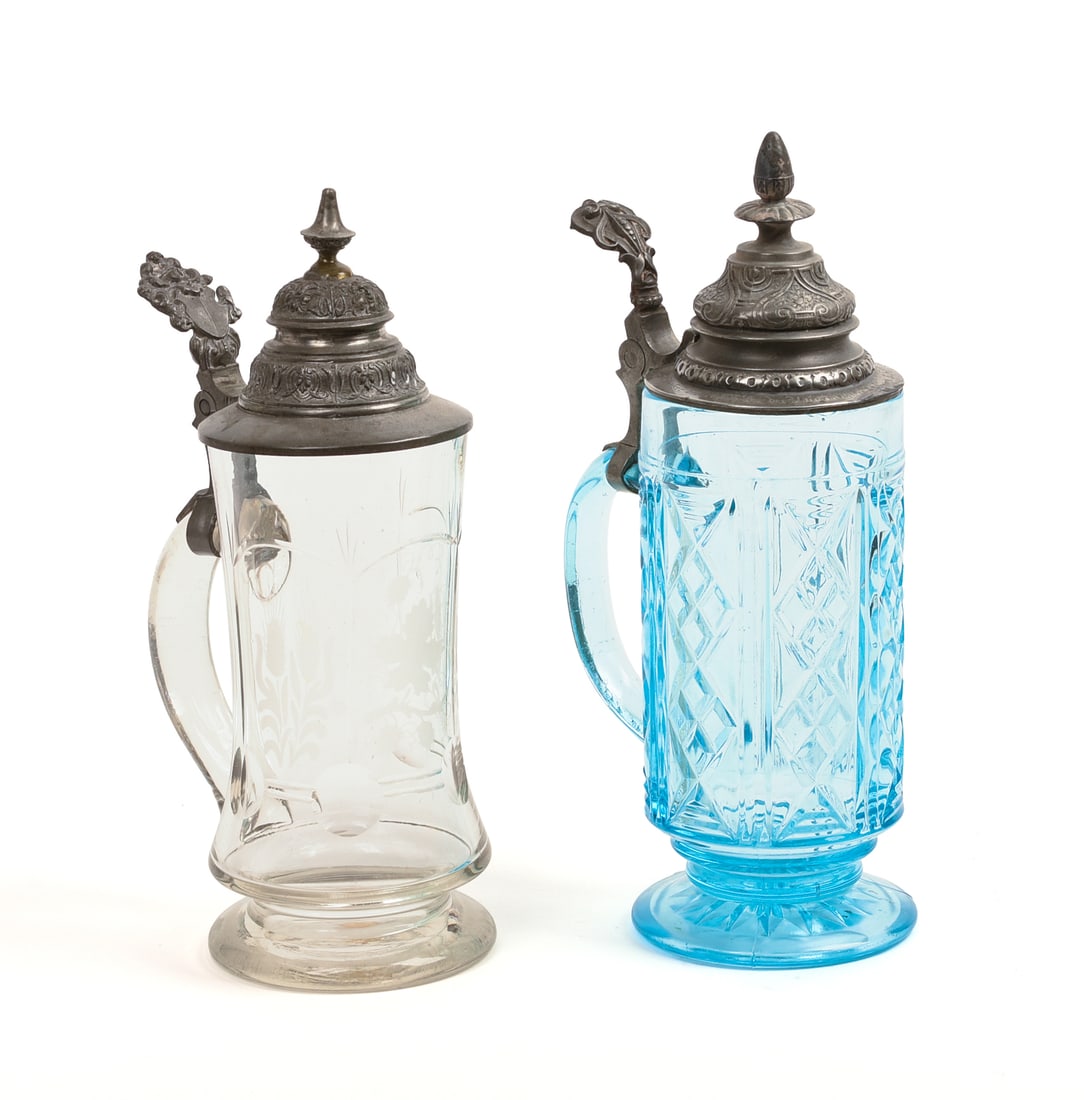Two Glass Steins With Pewter Tops.: Blue, height 10.5 inches, and a clear example