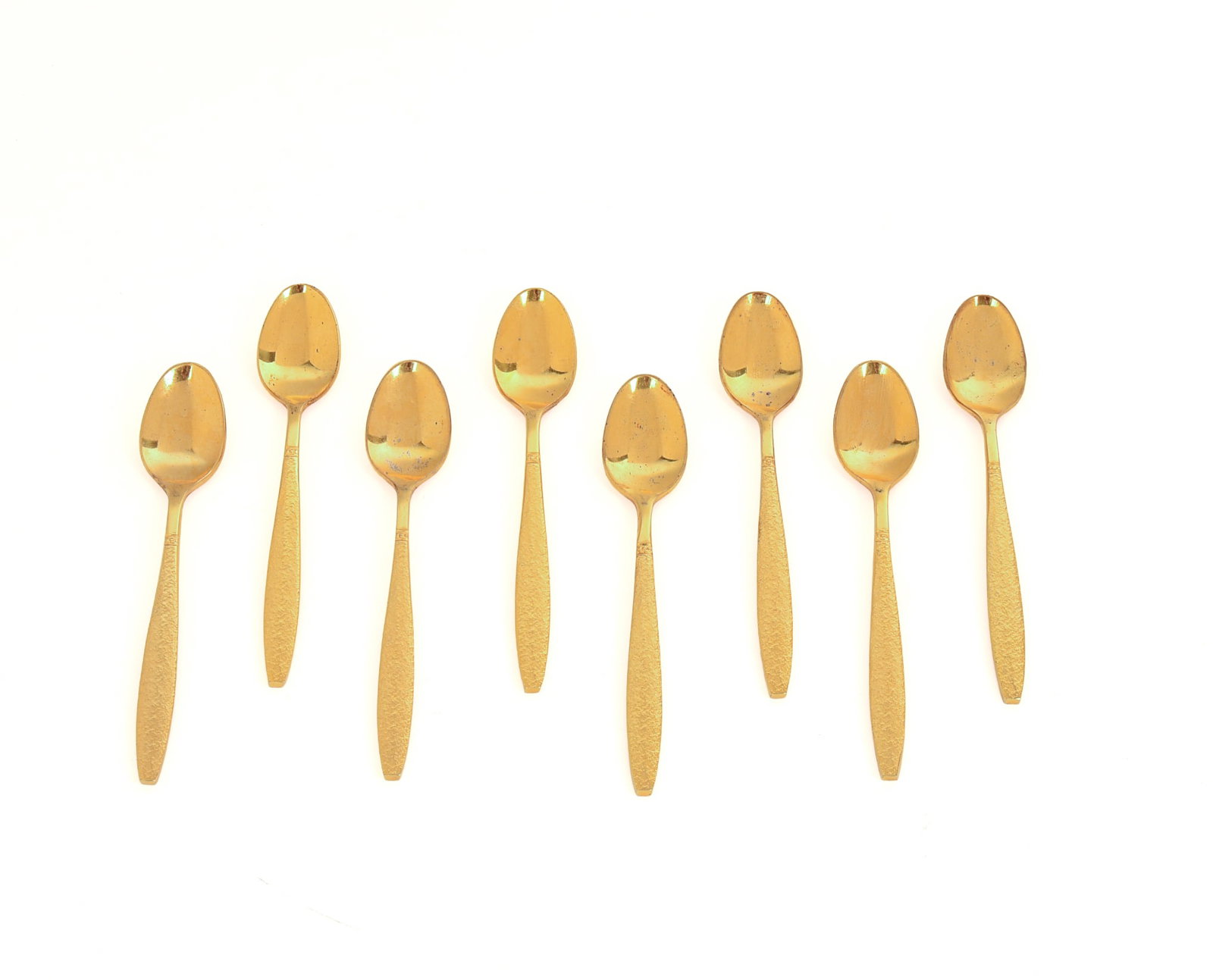 Eight Gold Wash Demitasse Spoons.: Length 4.5 inches.