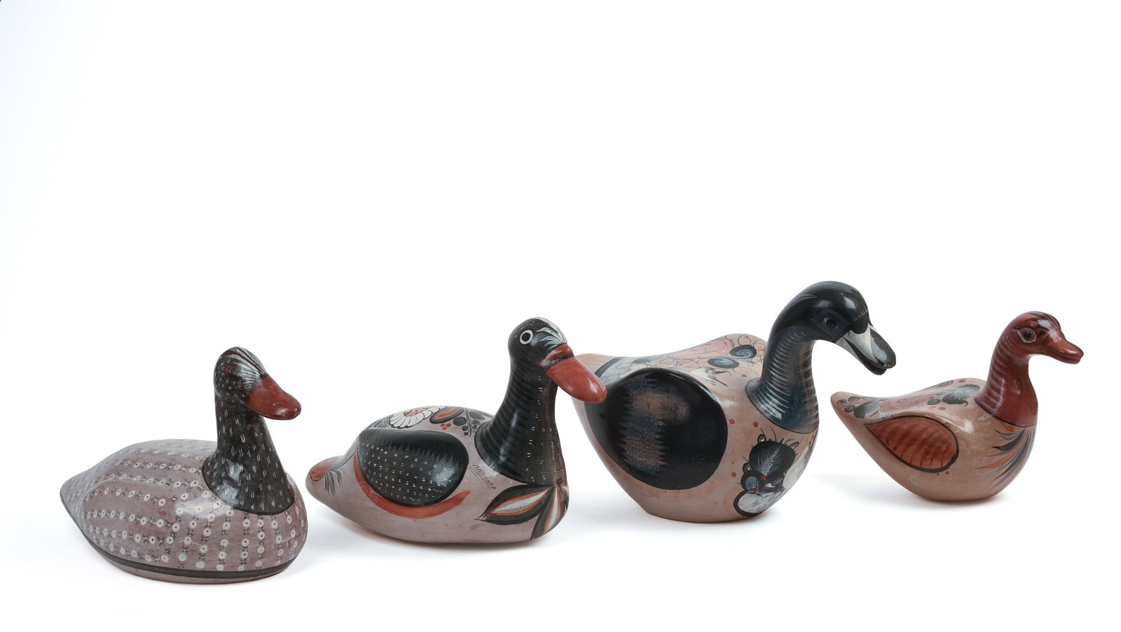 Four Mexcian Tonala Folk Art Duck Decoys.: Lengths 11 to 14 inches.