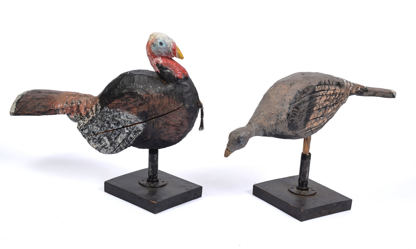 Pair of Carved Wooden Sculptures of Turkeys.: Lengths 29 and 27 inches. Stands included.