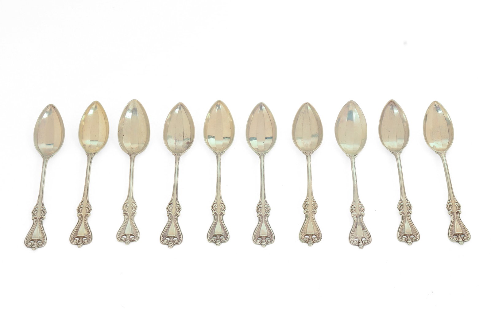 Ten Sterling Silver Grapefruit Spoons.: Length 5.25 inches, 257 grams.