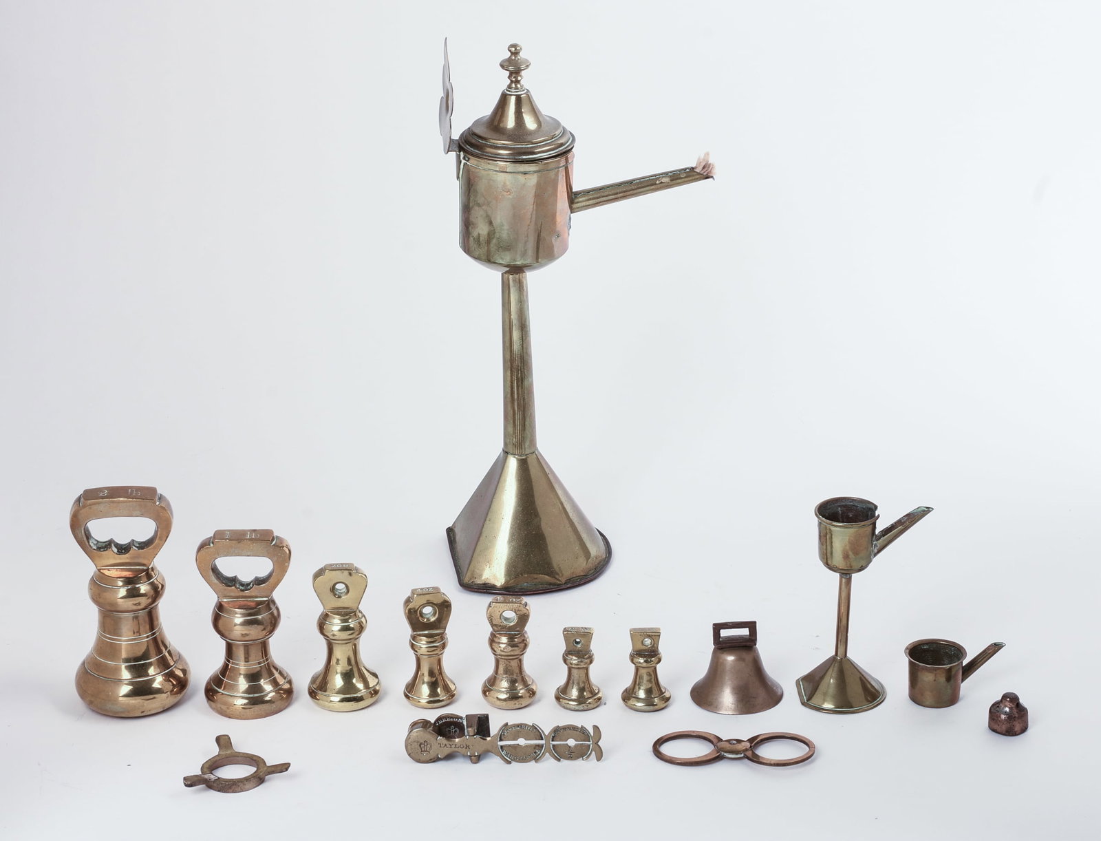 Set of Brass Weights and an Oil Lamp.: Largest weight 1 pound, height of lamp 12 inches.