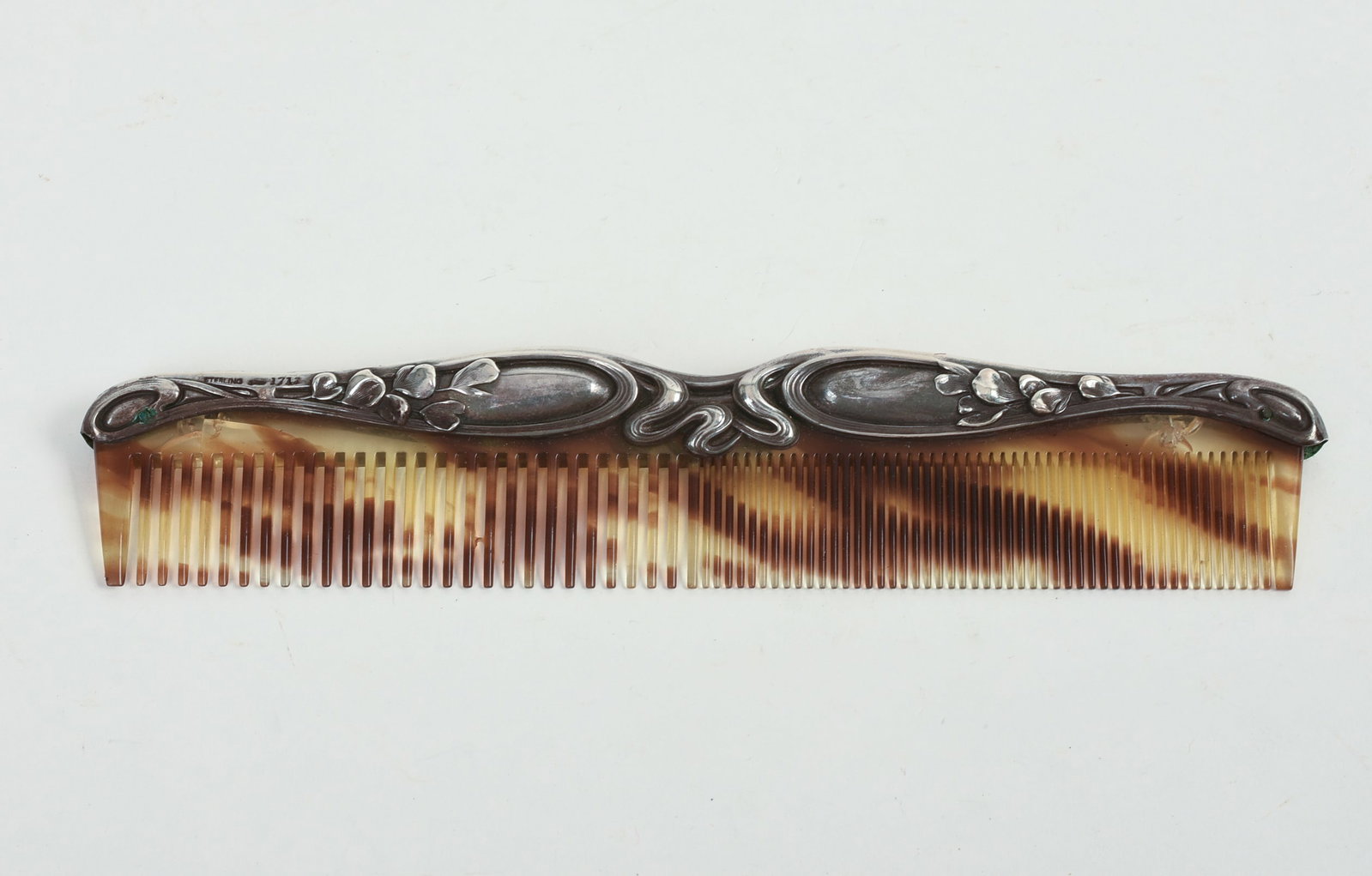Sterling and Tortoiseshell Pattern Comb.: Length 7.5 inches.