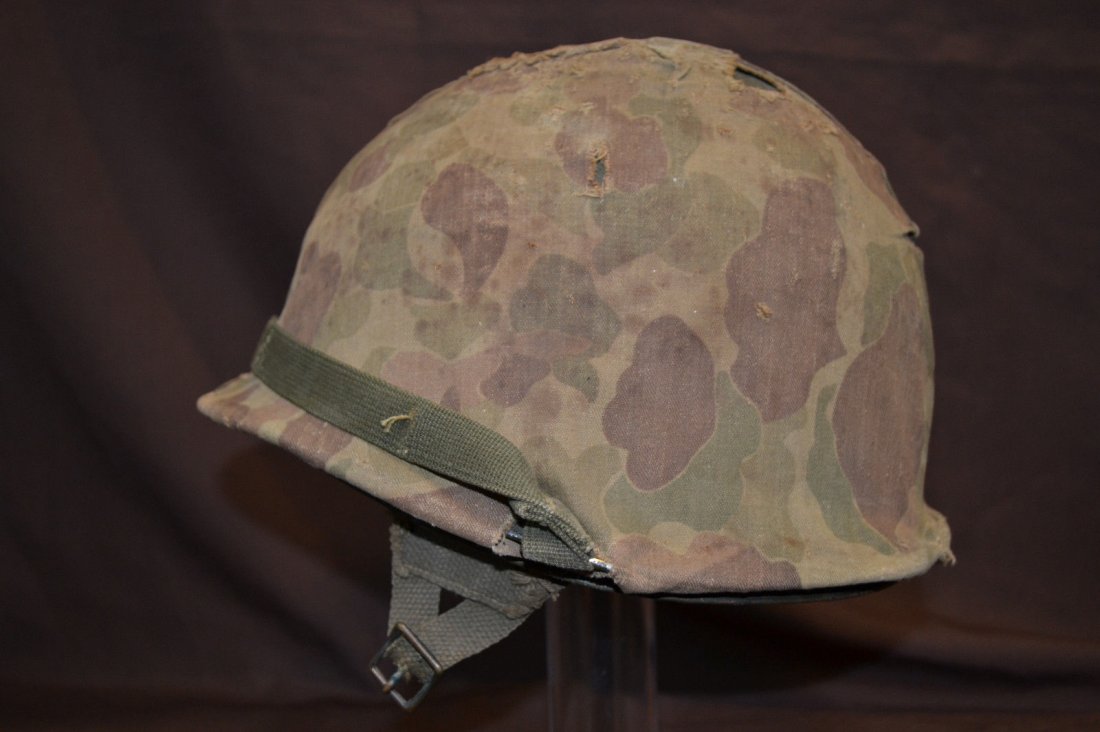 WWII PARATROOPER US AIRBORNE M-1 HELMET/ LINER / COVER: WWII AMERICAN PARATROOPER US AIRBORNE M-1 HELMET WITH LINER AND COVER . LATE WAR 1945 . SWIVEL BALES . GOOD ORIGINAL CONDITION WITH WELL WORN CAMOUFLAGE COVER WITH WEAR AND HOLES AND WESTINGHOUSE LINE