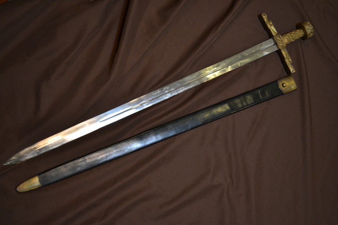 HUGE REPRODUCTION OF MEDIEVAL SWORD OF CHARLEMAGNE: HUGE 45" LONG REPRODUCTION OF MEDIEVAL SWORD OF CHARLEMAGNE . COMES WITH LEATHER SCABBARD. 38" LONG BLADE .