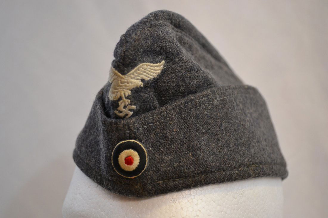 WWII NAZI LUTWAFFE OVERSEAS CAP HAT: WWII NAZI LUTWAFFE OVERSEAS CAP HAT . ORIGINAL IN EXTRA FINE CONDITION WITH MINIMAL WEAR . SILK TYPE MATERIAL LINING WITH STILL VISIBLE RNB NUMBER IN INK . OUTSTANDING EXAMPLE . SIZE AROUND 57