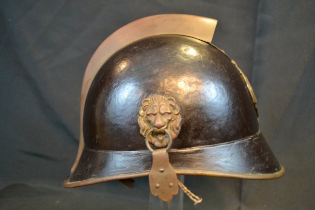 AUSTRO-HUNGARIAN K.U.K. PRE WWI ERA FIREFIGHTERS HELMET: NICE AUSTRO-HUNGARIAN K.U.K. PRE WWI ERA FIREFIGHTERS HELMET . STEEL AND BRASS CONSTRUCTION COMPLETE WITH LEATHER LINER . CITY OF EITZERSTHAL BADGE . CHINSTRAP IS ONLY PARTIALLY REMAINS .