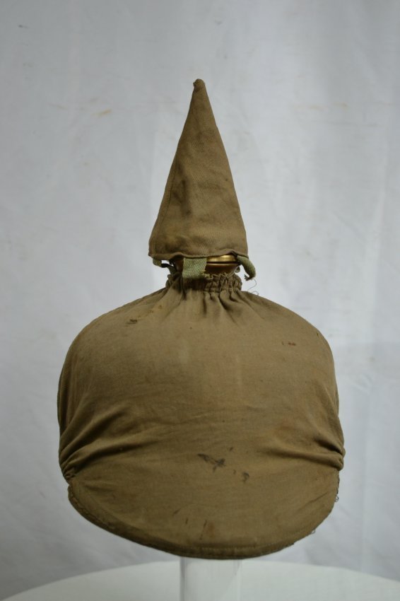 IMPERIAL GERMAN PRUSSIAN PICKELHAUBE SPIKE HELMET: IMPERIAL GERMAN PRUSSIAN PICKELHAUBE OFFICER'S SPIKE HELMET WITH RARE CLOTH FIELD COVER. COVER IS VERY NICE AND CLEAN. THE HELMET IS IN RELIC CONDITION BODY HAS TEARS AND MISSING FRONT PLATE AND CHIN 