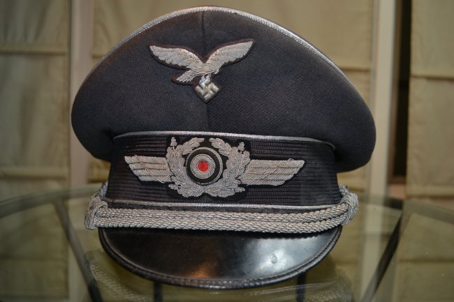 WWII GERMAN NAMED LUFTWAFFE OFFICER'S VISOR HAT: WWII GERMAN LUFTWAFFE OFFICER'S VISOR HAT . WELL WORN INSIDE . NICE AND CLEAN ON THE OUTSIDE . GREAT SADDLE SHAPE .NAMED .VERY HIGH QUALITY.