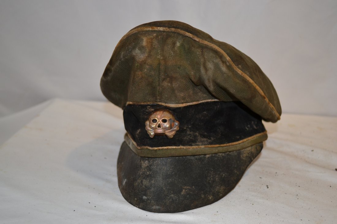 WWII NAZI SS OFFICER'S FIELD CRUSHER TYPE VISOR HAT CAP: WWII NAZI SS OFFICER'S FIELD CRUSHER TYPE VISOR HAT CAP . REALLY SALTY AND ROUGH CONDITION. CONSIGNER STATED IT WAS A BARN FIND IN ESTONIA . GREAT CHARACTER . EARLY SCULL . EAGLE IS MISSING . THRU CRU