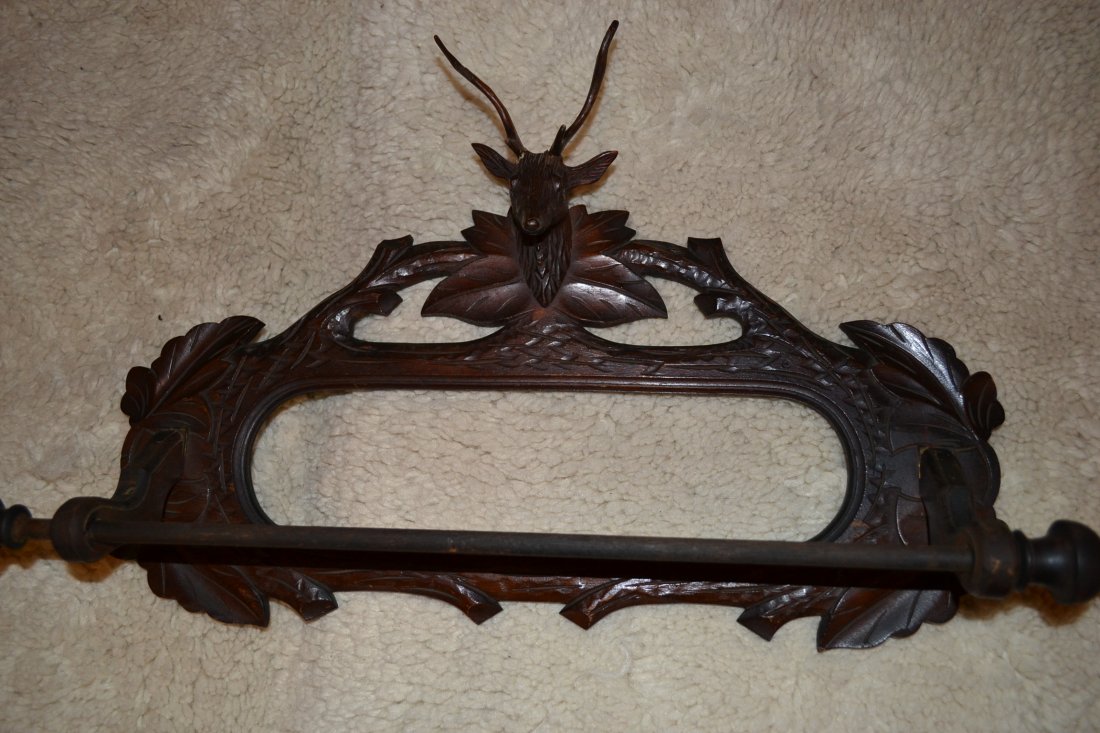 ANTIQUE GERMAN BLACK FOREST STYLE WOOD TOWEL HANGER: ANTIQUE GERMAN BLACK FOREST STYLE WOOD TOWEL HANGER . DARK CARVED WOOD WITH TRADITIONAL GERMAN HUNTING STYLE. 25" X 15"