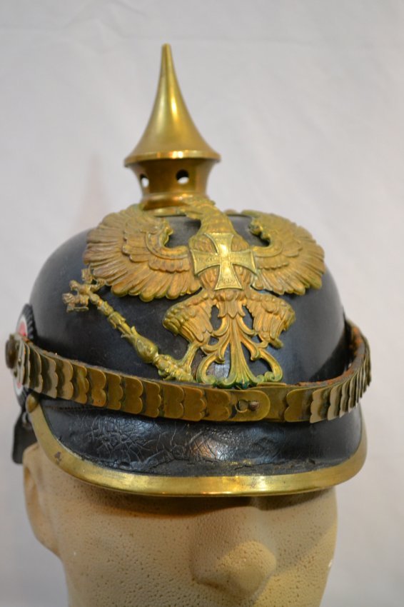 IMPERIAL GERMAN PRUSSIAN GUARD PICKELHAUBE SPIKE HELMET: IMPERIAL GERMAN PRUSSIAN PICKELHAUBE SPIKE HELMET . RESERVE OFFICER. BRASS HARDWARE WITH SILVER RESERVE CROSS TO THE FRONT WAPPEN. COMPLETE WITH ITS ORIGINAL LINER INSIDE AND NICELY MARKED WITH INK ST