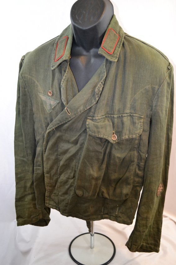WWII GERMAN ARMY PANZER ARMORED CREW WRAP JACKET: WWII GERMAN ARMY PANZER ARMORED CREW WRAP UNIFORM JACKET . WELL WORN LATE WAR EXAMPLE WITH LATE WAR TRIANGULAR EAGLE BREAST PATCH . RARE !