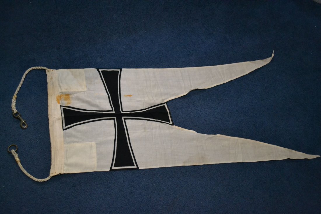 WWII GERMAN NAVY KRIEGSMARINE FLEET SHIPS PENNON: WWII GERMAN NAVY KRIEGSMARINE FLEET SHIPS PENNON . WHITE 48" LONG PENNON AND 19" WIDE. NICELY INK STAMPED AND HAS A MANUFACTURING LABEL . STILL RETAIN ITS ORIGINAL HANGING ROPE WITH BRASS HARDWARE. SO