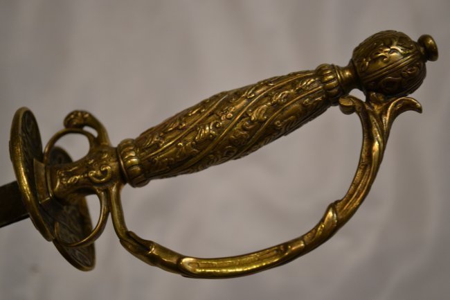 18th CENTURY FRENCH INTERESTING CHILD RAPIER SWORD: 18th CENTURY FRENCH INTERESTING CHILD RAPIER SWORD . TRIANGULAR BLADE .BRASS HANDLE .MADE FOR A NOBLE CHILD .BLUNT POINT. 26" LONG WITH 21" LONG BLADE . RARE PIECE !