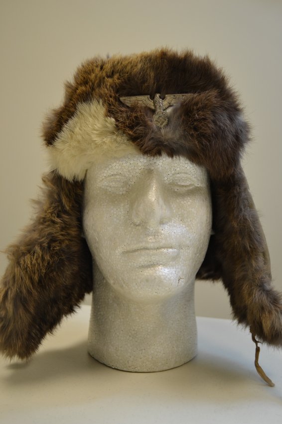 WWII GERMAN ARMY RUSSIAN FRONT WINTER FUR HAT: WWII GERMAN ARMY RUSSIAN FRONT WINTER FUR HAT. NICE WORN CONDITION. EAGLE TO THE FRONT . ARMY ISSUED . RB NUMBERED AND SIZE 57 . GREAT EXAMPLE