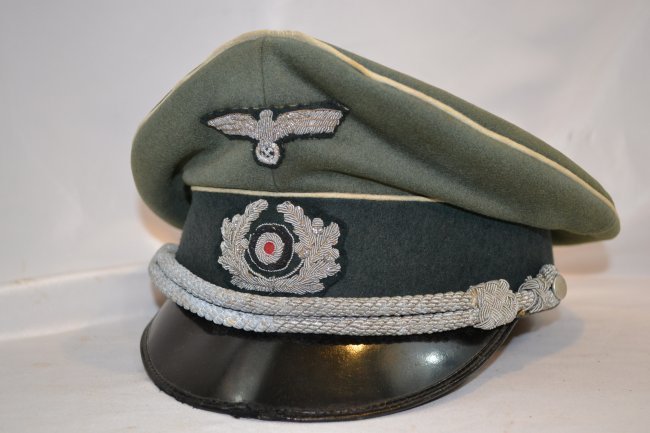 WWII GERMAN ARMY INFANTRY OFFICER'S CRUSHER VISOR HAT: WWII GERMAN ARMY INFANTRY OFFICER'S VISOR HAT . CRUSHER TYPE WITH SOFTER VISOR . VERY POPULAR IN THE FIELD WITH THE OFFICERS. MADE BY EREL . WELL WORN BUT STILL IN GREAT CONDITION.WILE EMBROIDERED INS