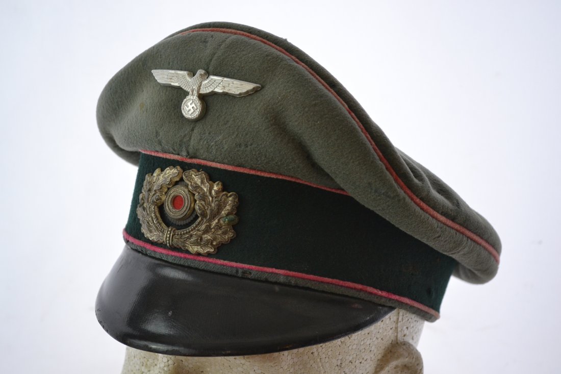 WWII GERMAN PANZER OFFICER'S VISOR HAT CRUSHER STYLE: WWII GERMAN PANZER OFFICER'S VISOR HAT. CRUSHER STYLE CAP . BEAUTIFUL SADDLE SHAPE . WELL WORN EXAMPLE.SOME NIPS AND DISCOLORATION. NICE INTERIOR WITH OLD PERIOD NEWSPAPER UNDER THE BAND TO MAKE IT FI