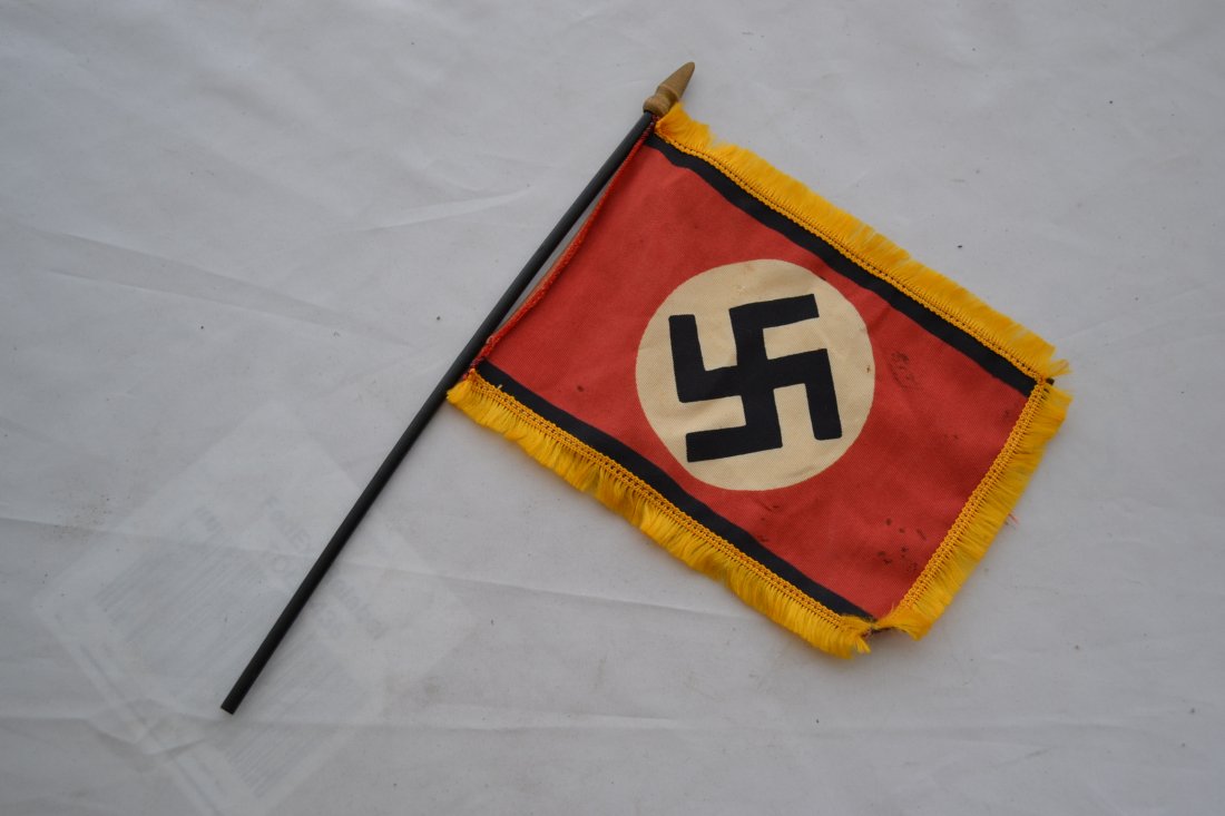 WWII NAZI GERMAN FUNERAL FLAG ON A WOODEN POLE: WWII NAZI GERMAN FUNERAL FLAG SMALL SIZE ON A WOODEN POLE . SINGLE SIDED PRINTED 7 X 6 NAZI FLAG WITH BLACK BORDERS . 11" WOODEN POLE. DISPLAYS AGE AND STAINS BUT IN GREAT CONDITION. RARE .