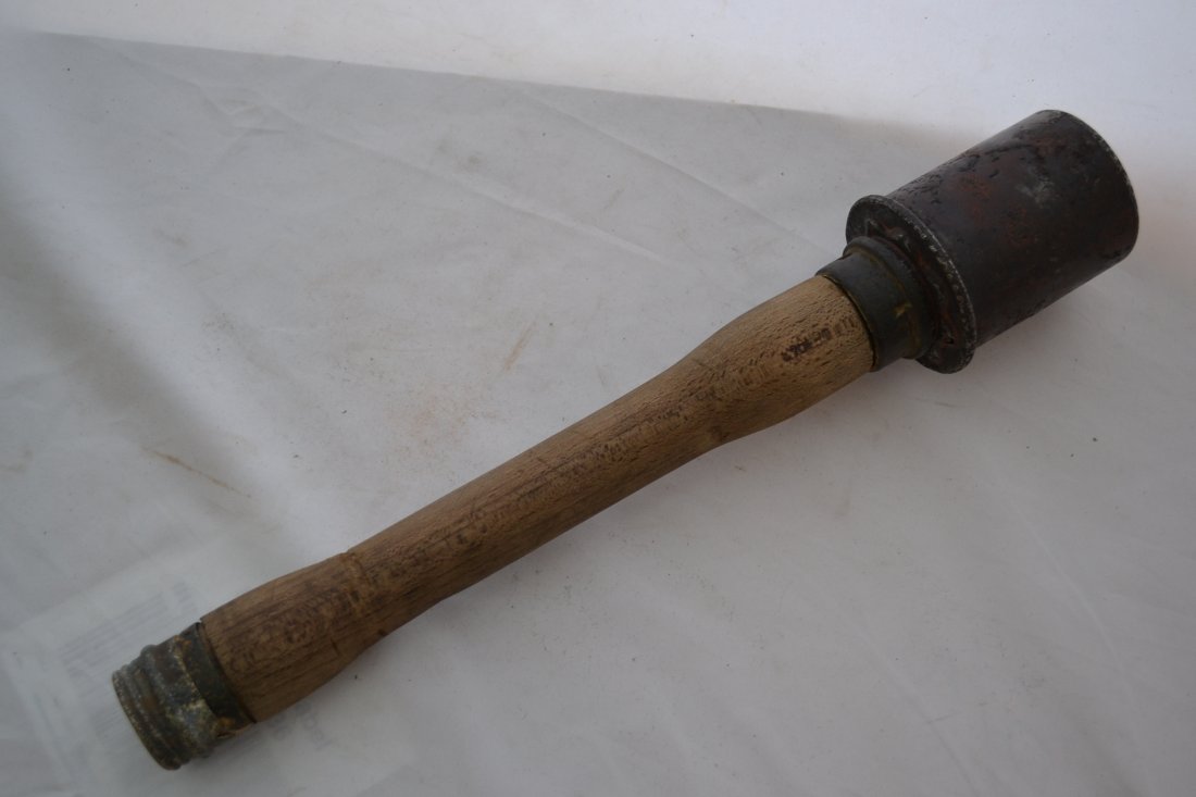 WWII GERMAN M24 HAND GRENADE RUSSIAN FRONT DUG: WWII GERMAN M24 HAND GRENADE . RUSSIAN FRONT DUG. ALL ORIGINAL. EMPTY AND COMPLETE INERT .GREAT CONDITION FOR BEING IN THE GROUND FOR MORE THEN 80 YEARS . WOOD IS AMAZINGLY GOOD CONDITION AND DATED 19