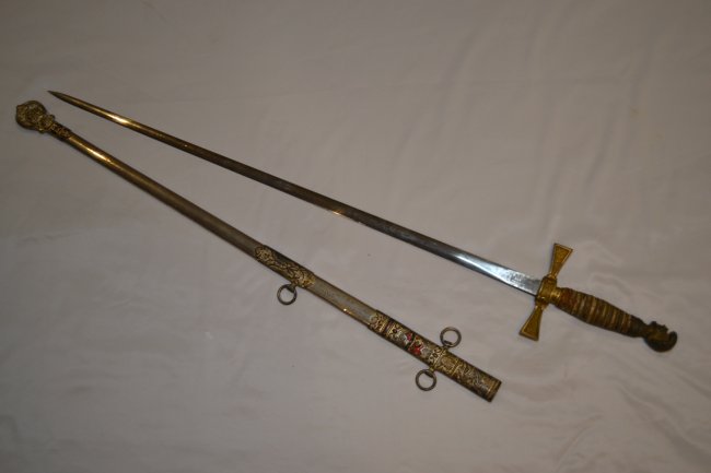ANTIQUE KNIGHTS TEMPLAR SWORD GERMAN MADE BLADE NAMED: ANTIQUE KNIGHTS TEMPLAR SWORD . GERMAN MADE BLADE. NAMED ON THE SCABBARD. BEAUTIFUL SWORD. 36" LONG WITH 28" ENGRAVED BLADE .