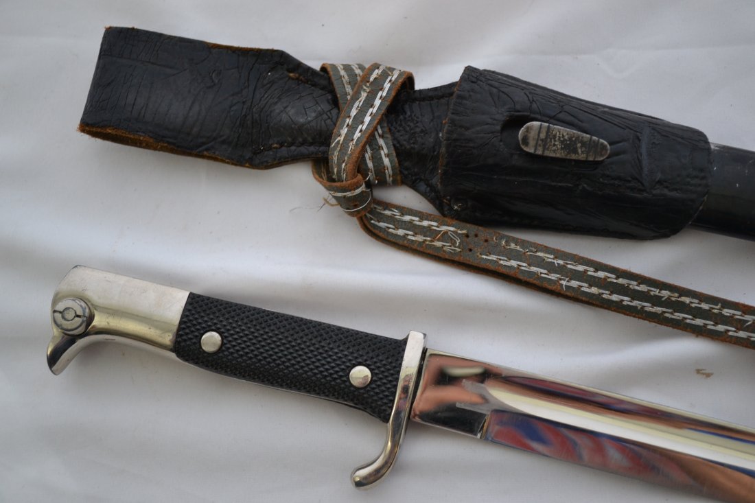 WWII GERMAN E.PACK & SOHN LONG DRESS BAYONET COMPLETE: WWII GERMAN E.PACK & SOHN LONG DRESS BAYONET COMPLETE WITH SCABBARD , LEATHER FROG AND KNOT. VERY NICE BRIGHT BLADE . ONE OF THE BEST MAKERS OF THESE PARADE BAYONETS . VERY HIGH QUALITY . 16 1/2 LONG.