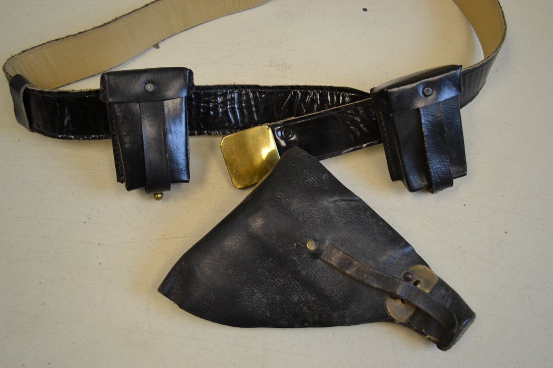 WWII ITALIAN FASCIST MILITARY LEATHER BELT AND HOLSTER: WWII ITALIAN FASCIST MILITARY LEATHER BELT AND HOLSTER . BLACK PARADE STYLE BELT WITH BRASS BUCKLE . 2 AMMO POUCHES AND SMALL AUTOMATIC PISTOL HOLSTER. VERY GOOD CONDITION .