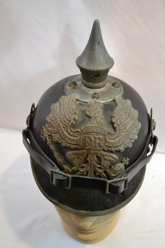 WWI IMPERIAL GERMAN PRUSSIAN PICKELHAUBE SPIKE HELMET: WWI IMPERIAL GERMAN PRUSSIAN PICKELHAUBE SPIKE HELMET . M1915 . GRAY WARTIME FITTINGS. VERY GOOD CONDITION FOR ITS AGE. CHINSTRAP AND COCKADES ARE REPLACEMENT. ORIGINAL LINER