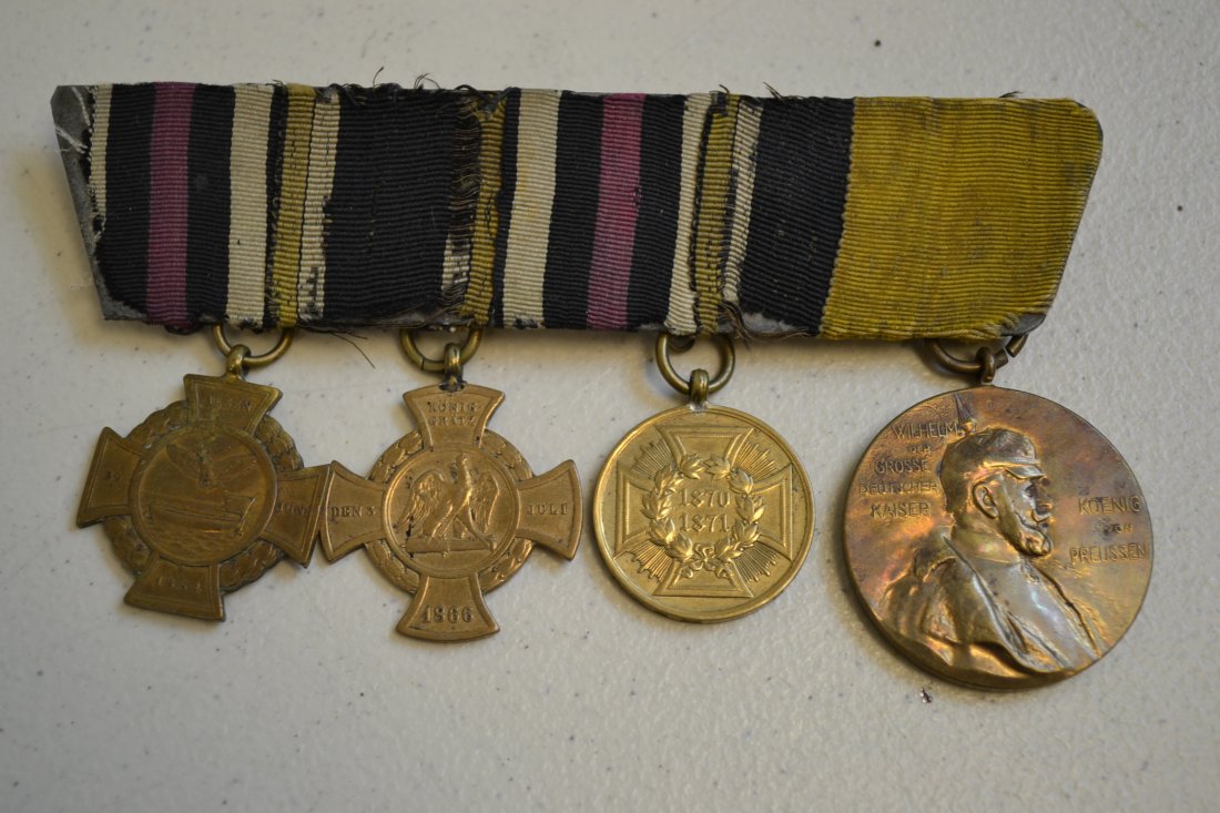 IMPERIAL GERMAN FRANCO PRUSSIAN WAR VETERAN MEDAL BAR: IMPERIAL GERMAN FRANCO PRUSSIAN WAR VETERAN MEDAL BAR .NICE GROUP OF 4 MEDALS MOUNTED ON EARLY STYLE RIBBON BAR . RARE .