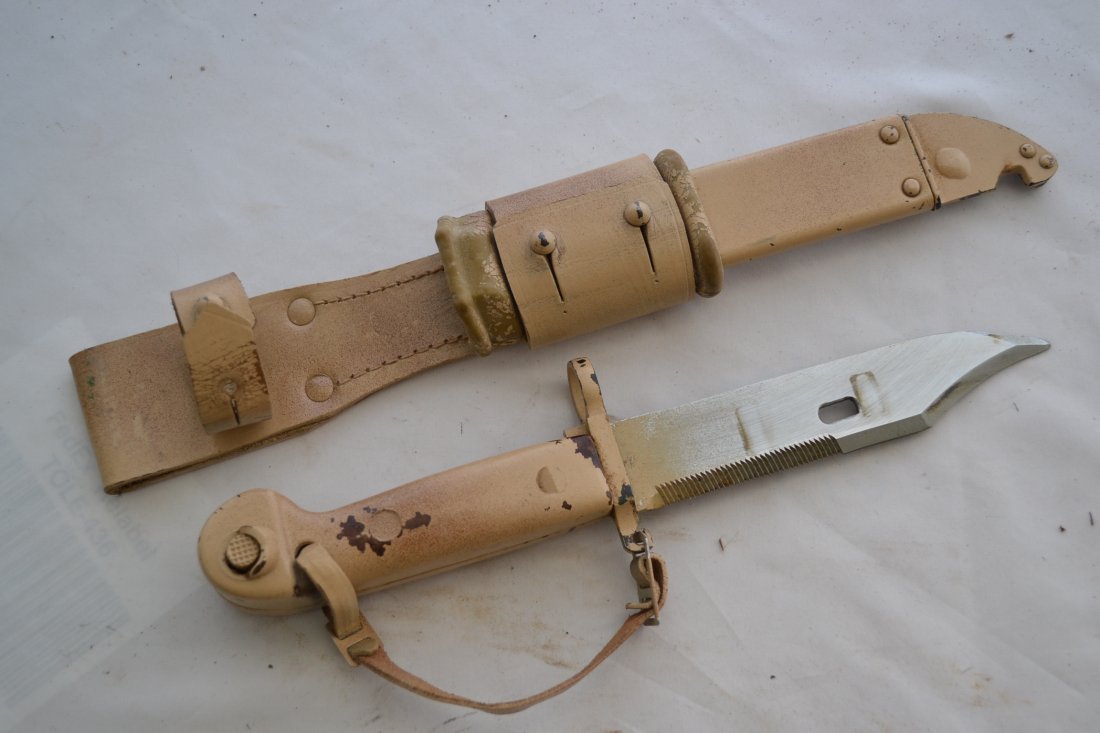 IRAQI ARMY USED AK 47 KBAYONET KNIFE IRAQ WAR SOUVENIR: IRAQI ARMY USED AK 47 BAYONET KNIFE IRAQ WAR SOUVENIR . DESERT STORM SOUVENIR BROUGHT BACK BY US SOLDIER . THE ENTIRE BAYONET IS COVERED WITH TAN DESERT COLOR CAMOUFLAGE PAINT. NICE OVERALL CONDITION 
