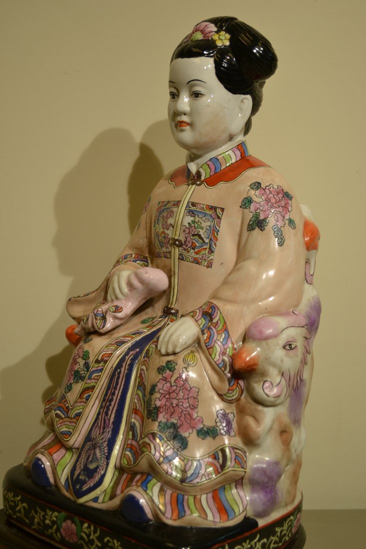 LARGE CHINESE PORCELAIN STATUE ON WOODEN STAND: LARGE CHINESE PORCELAIN STATUE ON WOODEN STAND. 10X9 AND 21" TALL