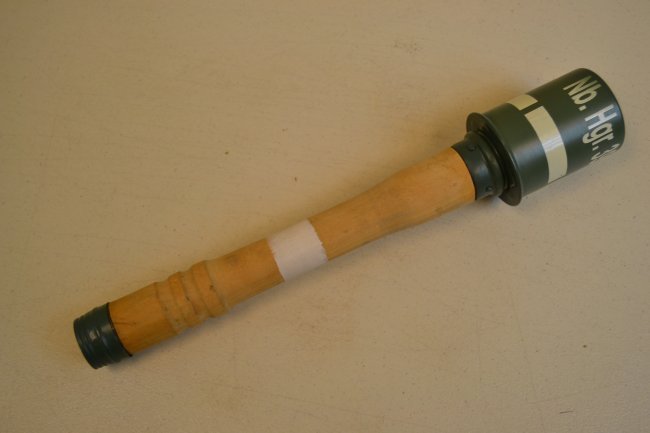 WWII GERMAN M24 SMOKE HAND GRENADE REPRODUCTION: WWII GERMAN M24 SMOKE HAND GRENADE REPRODUCTION . COMPLETELY INERT , HIGH QUALITY REPRODUCTION WITH METAL SCREW IN TOP CANISTER AND PULL STRING ON THE BOTTOM FEATURING ALL THE MARKINGS LIKE ORIGINAL .