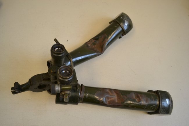 WWII GERMAN MILITARY TRENCH RABBIT EARS BINOCULARS: WWII GERMAN MILITARY TRENCH RABBIT EARS BINOCULARS . BATTLEFIELD DAMAGED . NICE WAR SOUVENIR . OPTICS IS DAMAGED . ORIGINAL FIELD GREEN PAINTED. VERY HEAVY .