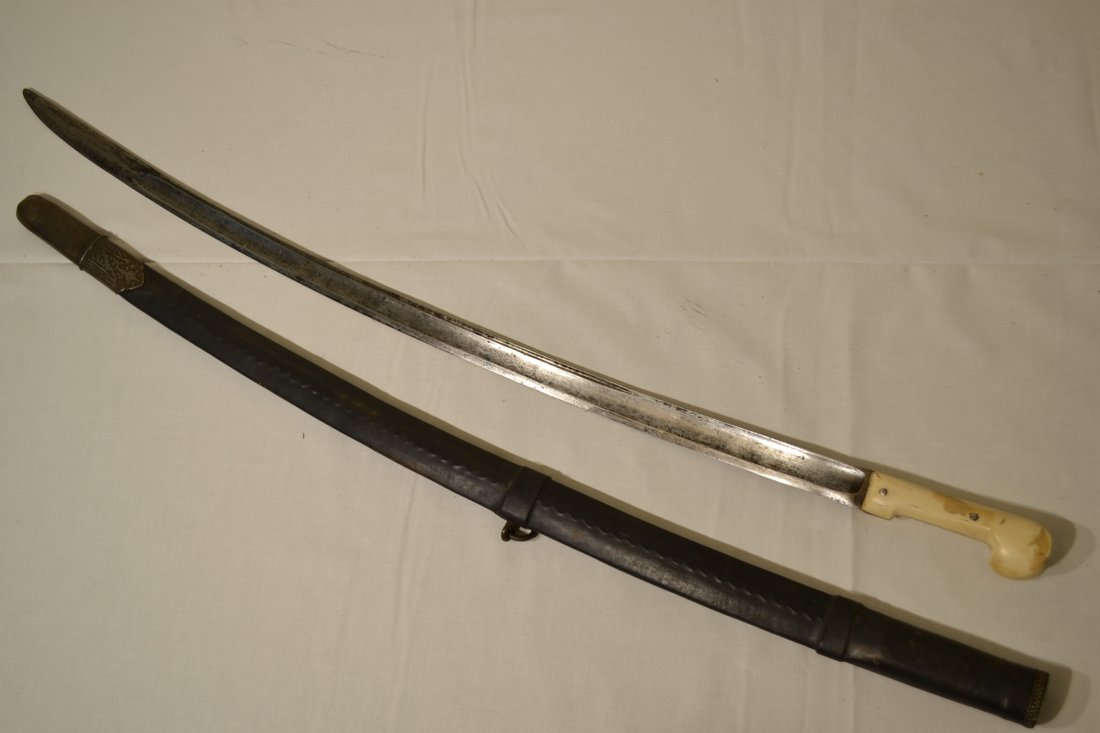 RUSSIAN COSSACKS CAUCASIAN MADE SHASHKA SWORD: RUSSIAN COSSACKS CAUCASIAN MADE SHASHKA SWORD . OLD BLADE WITH BONE GRIP HANDLE. RESTORED LEATHER ON THE SCABBARD. 35" LONG WITH 29" BLADE