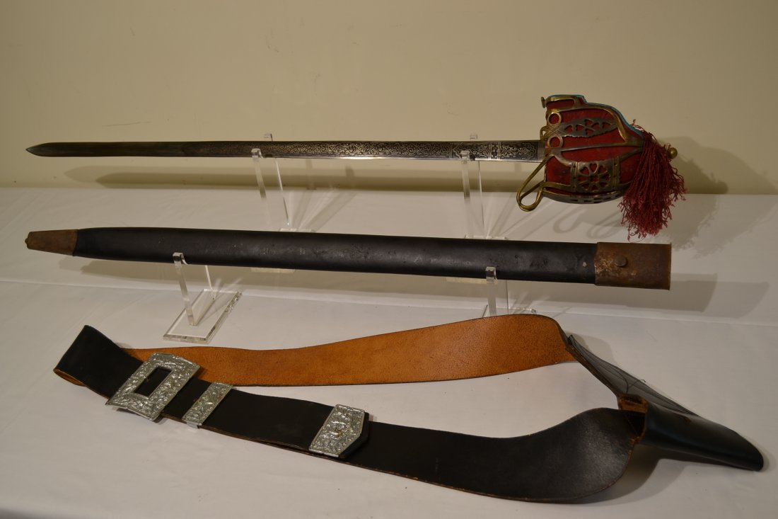 SCOTTISH HIGHLANDERS BASCKET HILT SWORD AND HANGER BELT: SCOTTISH HIGHLANDERS BASCKET HILT SWORD AND HANGER BELT . ENGRAVED DECORATED BLADE. 42" LONG WITH 33" BLADE