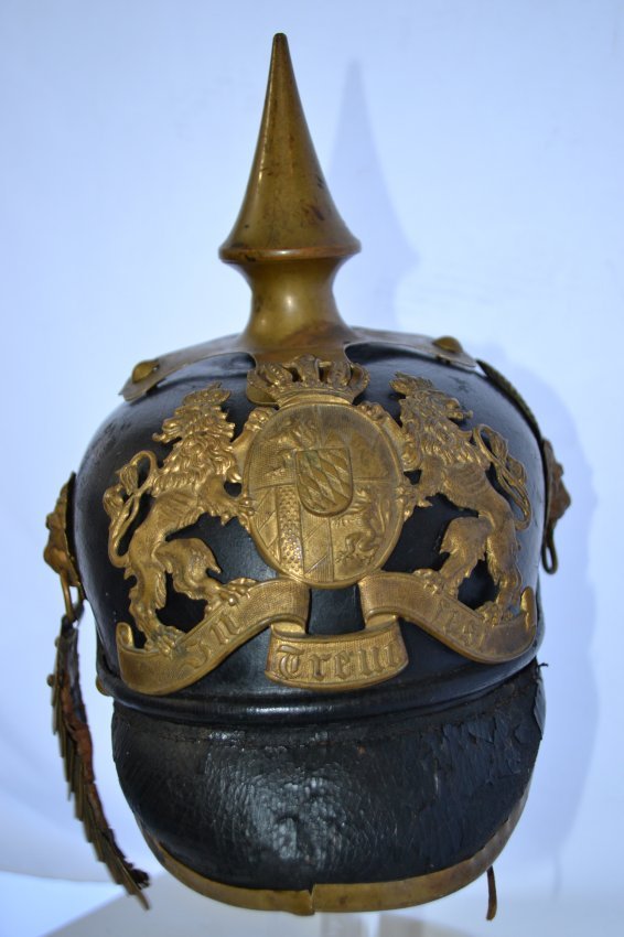 IMPERIAL GERMAN BAVARIAN PRE WWI PICKELHAUBE HELMET: IMPERIAL GERMAN BAVARIAN PRE WWI PICKELHAUBE HELMET . SHOWS ITS AGE. LEATHER IS DRY BUT STILL SOLID. BRASS FITTINGS. ONE SIDE OF CHINSCALES ARE GONE. EARLY BAVARIAN EXAMPLE.
