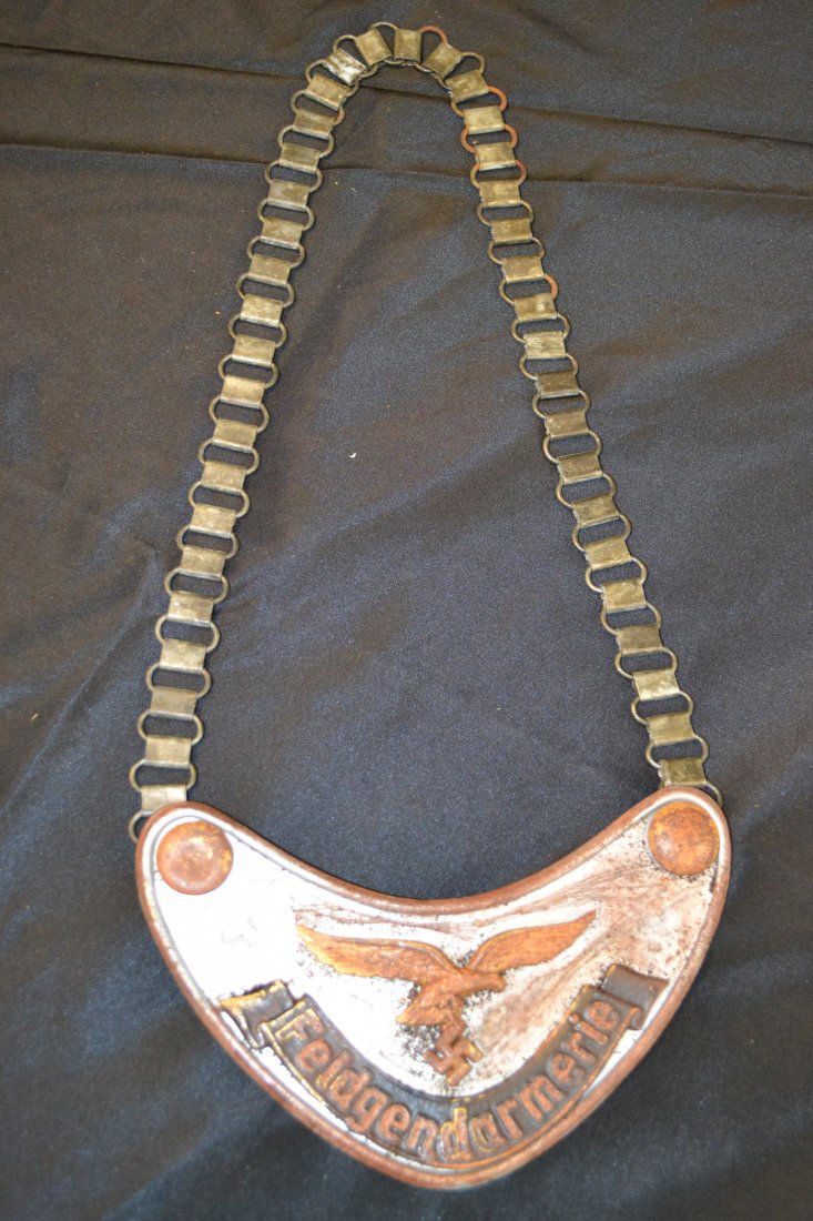 WWII GERMAN LUFTWAFFE FIELDGENDARMERIE GORGET: WWII GERMAN LUFTWAFFE FIELDGENDARMERIE GORGET . HEAVY WEAR TO THE FRONT. THE BACK IS MISSING A WOOL . LOOKS LIKE VERY HIGH QUALITY REPRODUCTION .