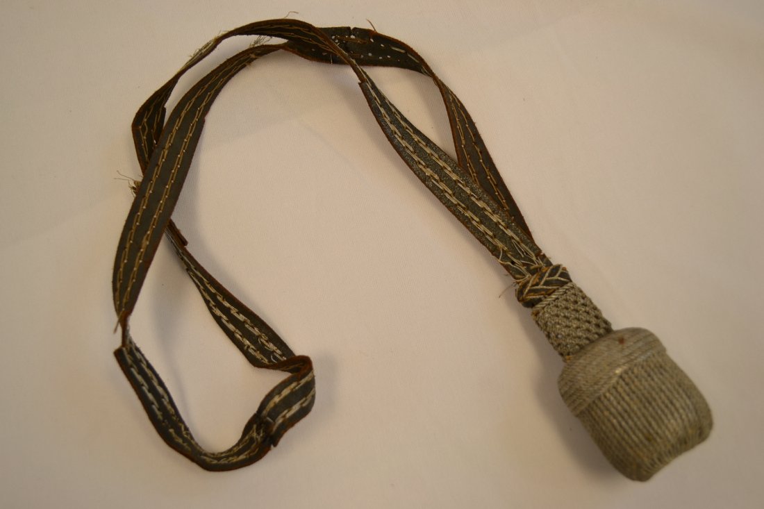 WWII GERMAN LEATHER SWORD / BAYONET KNOT: WWII GERMAN LEATHER SWORD / BAYONET KNOT . WELL USED CONDITION. SOME TEARS AND WEAR TO THE STRAP.