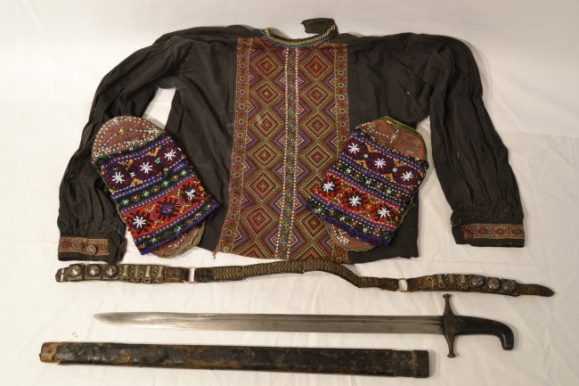 ANTIQUE GEORGIAN CAUCASIAN KHEVSUR DRESS WITH SWORD: ANTIQUE GEORGIAN CAUCASIAN KHEVSUR WARRIOR DRESS SHIRT , SHOES , PALASH SWORD AND BELT . SWORD.28" LONG WITH 22" BLADE.