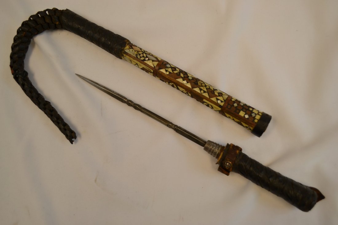 ANTIQUE MIDDLE EASTERN DECORATED RIDING WHIP DAGGER: ANTIQUE MIDDLE EASTERN DECORATED RIDING WHIP. DAGGER INSIDE THE GRIP HANDLE. SHOWS GREAT AGE. BONE INLAYS DECORATED . RARE. 16" LONG WITH 8" BLADE