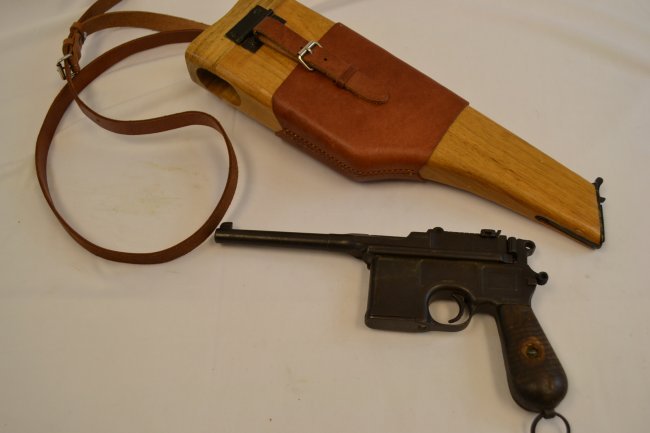 GERMAN C96 MAUSER BROOMHANDLE WITH WOOD STOCK: GERMAN C96 MAUSER BROOMHANDLE WITH WOOD STOCK . 1930\'S COMMERCIAL MODEL . IMPORT MARK. 7.63MM . NEW WOOD STOCK WITH LEATHER CARRIER. THE GUN FITS GOOD INSIDE . SERIAL # 818221 . FFL REQUIRED. NO INTE